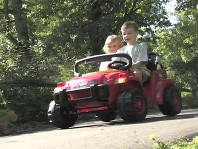 Mighty Wheelz 12V Vehicle Red / Yellow / Black  - image 4 from the video